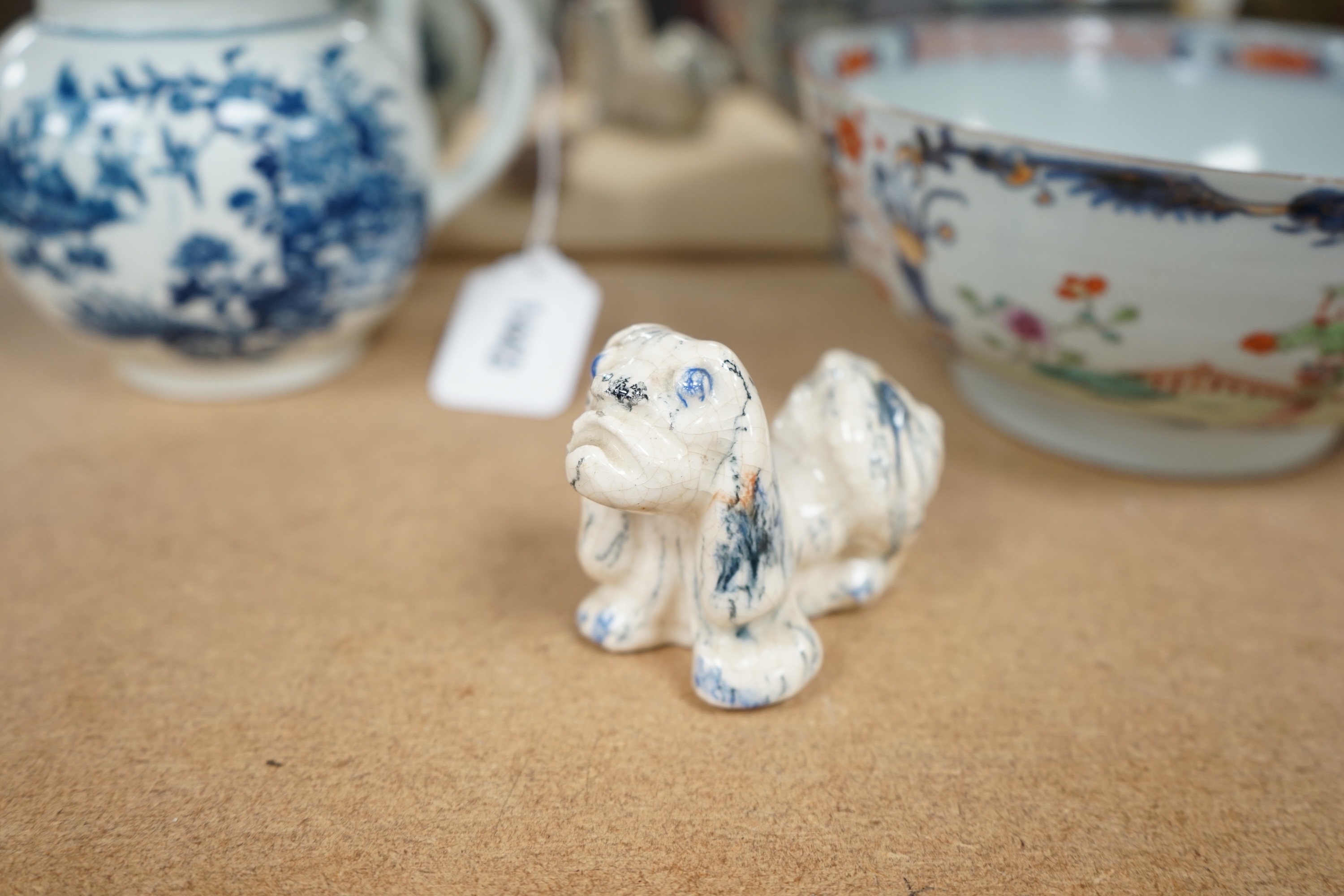 Five Chinese soapstone seals, a bronze figure of a Shou Lao, a pottery dog, a carved soapstone monkey and a Chinese famille rose bowl, 18th century, tallest 15cm high. Condition - poor to good